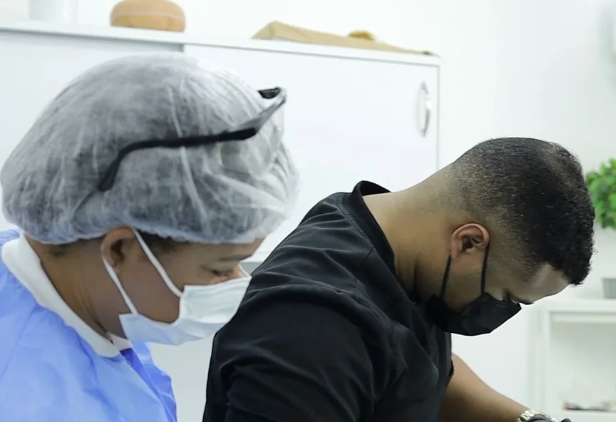 Dr. Daniel and his assistant at work